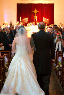 bride and father walking down aisle